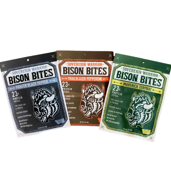 Three packages of Bison Bites with different flavors on a white background